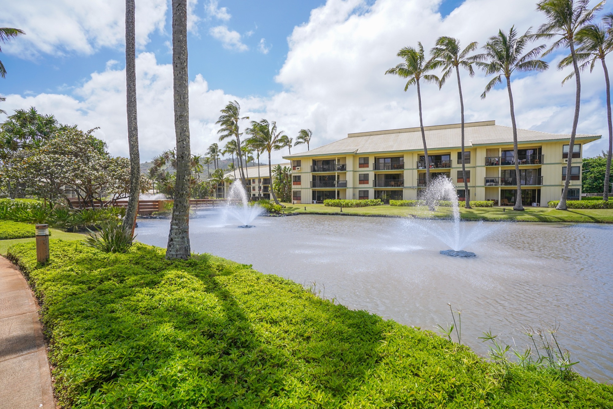 4330 Kauai Beach Drive, Unit E13 Lihue, HI 96766 - Photo 30 of 30 a view of a building with a park