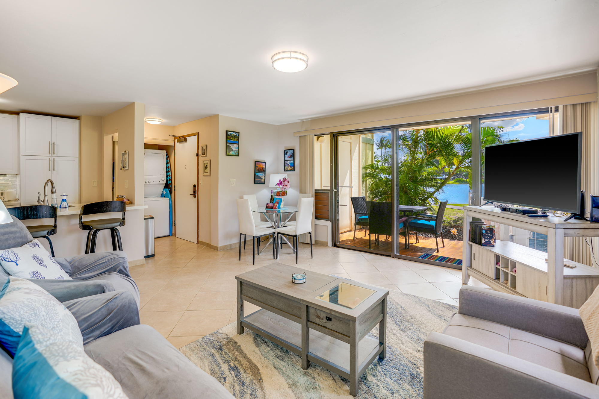 4330 Kauai Beach Drive, Unit E13 Lihue, HI 96766 - Photo 4 of 30 a living room with furniture and a flat screen tv