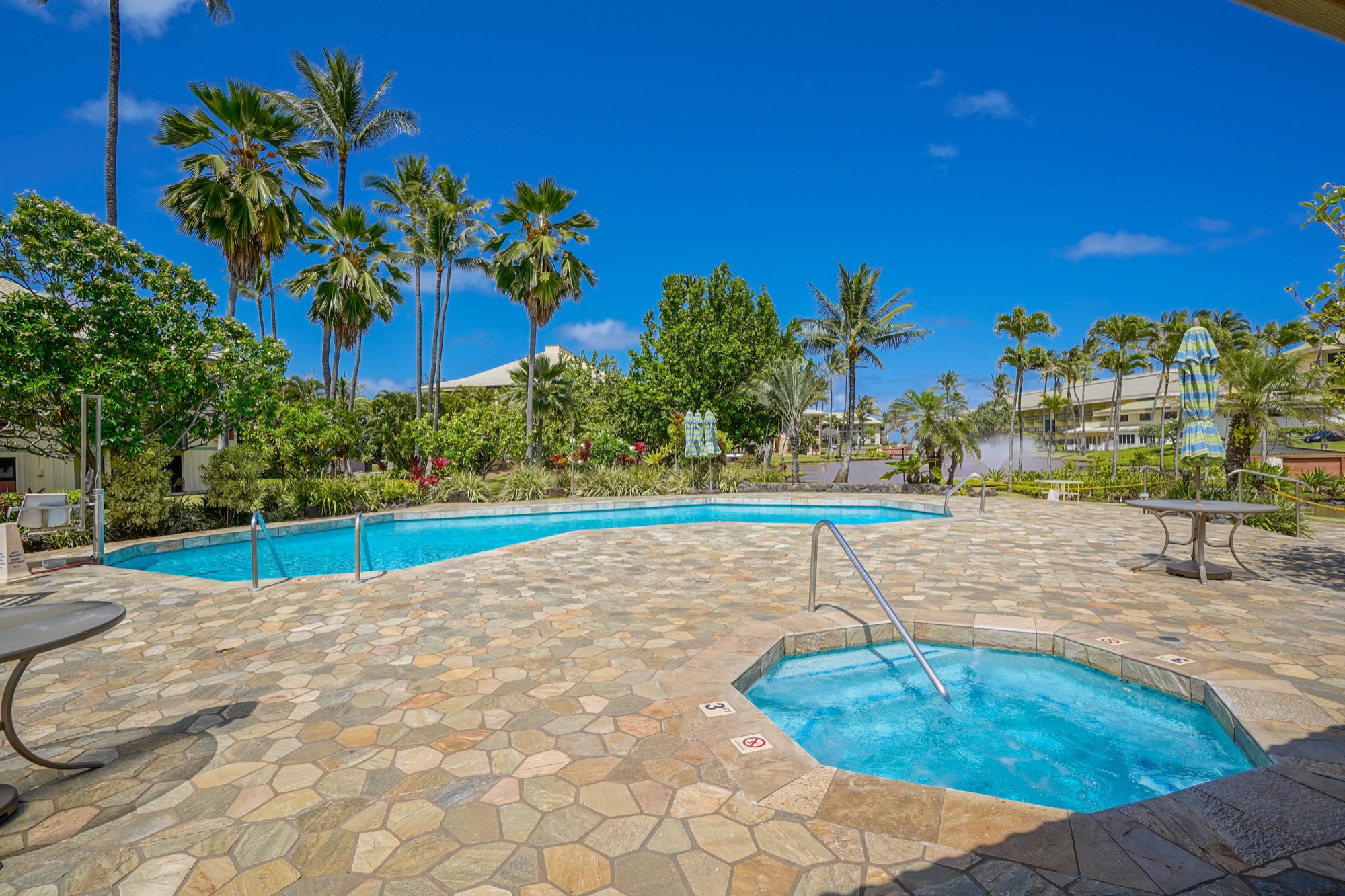 4330 Kauai Beach Drive, Unit E13 Lihue, HI 96766 - Photo 8 of 30 a view of a swimming pool with a patio