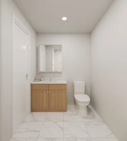 a bathroom with a granite countertop toilet and a sink