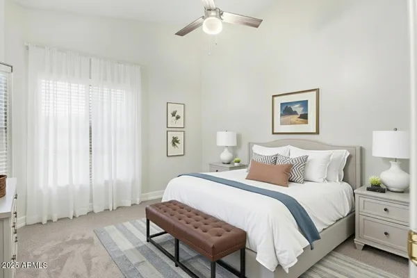 a bedroom with bed and a window