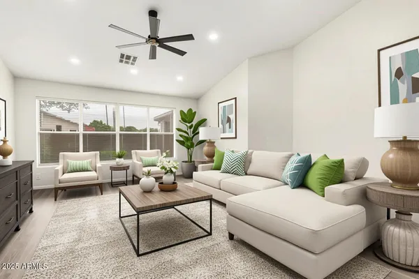 a living room with furniture and a large window
