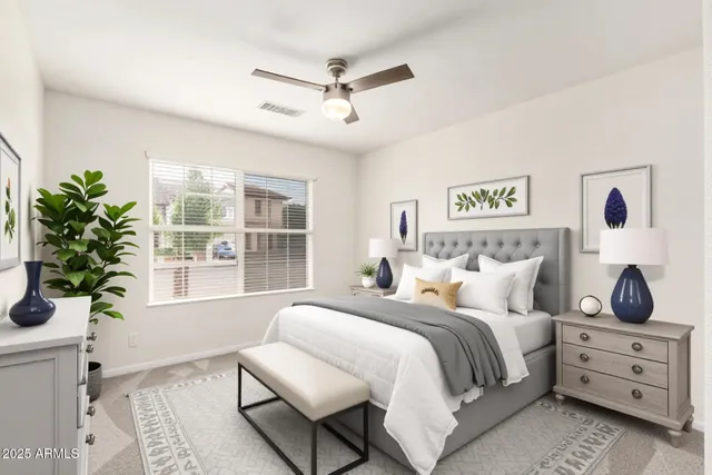 a bedroom with a bed and a window