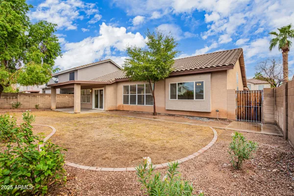 a house with trees in the background