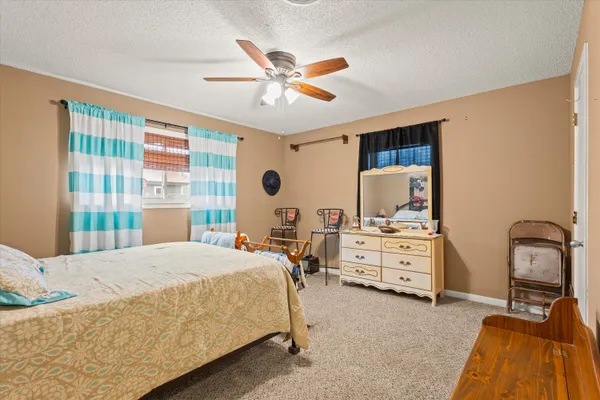 a bedroom with a bed and furniture