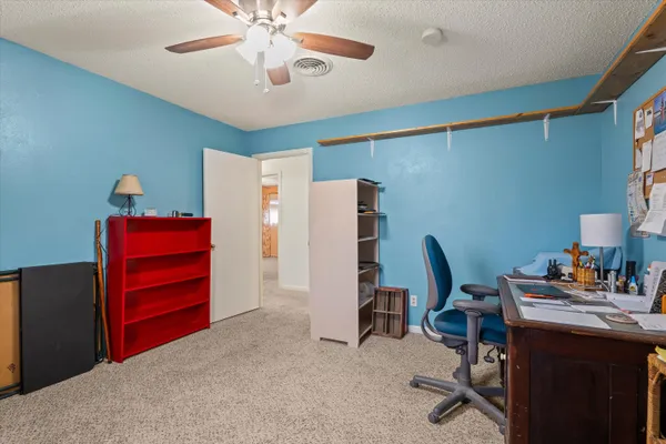 a workspace with furniture and a window