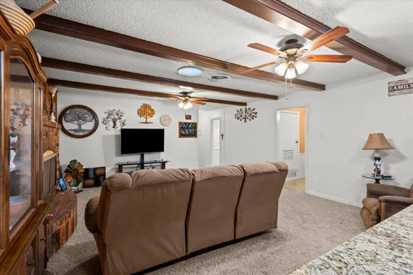 a living room with furniture and a clock