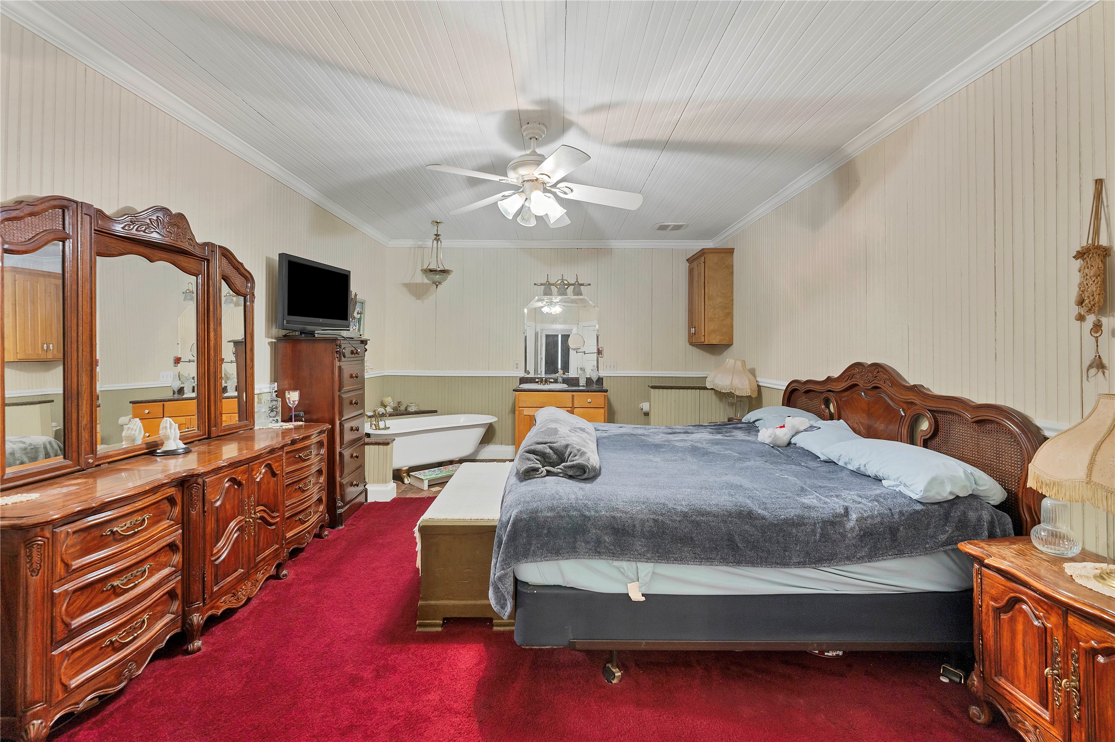 471 County Road 471 Road Thrall, TX 76578 - Photo 15 of 20 a bed room with a bed furniture and a tv