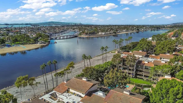 an aerial view of a house with a lake view