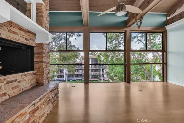 a view of room with window and wooden floor
