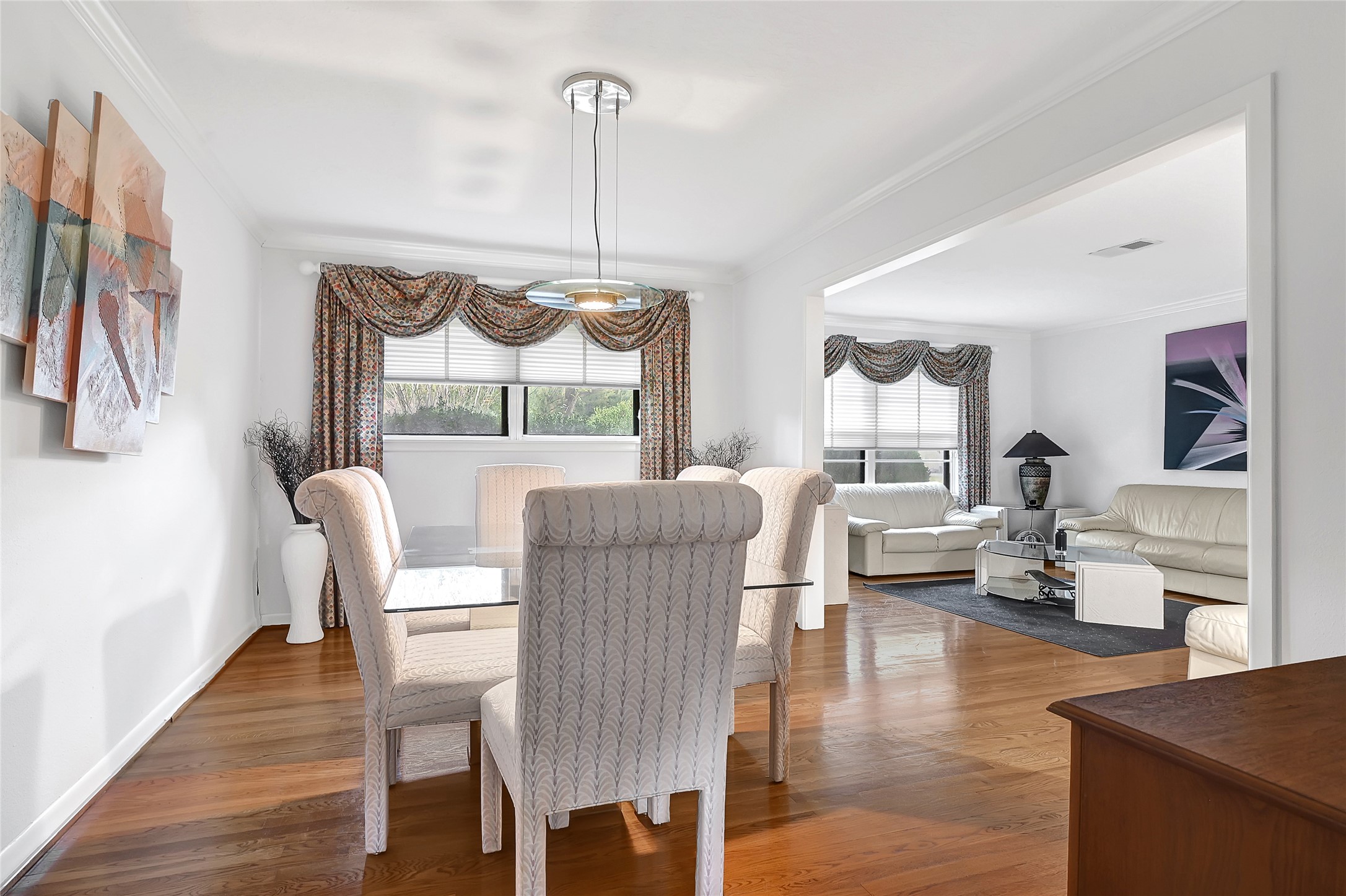 4831 Knickerbocker Street Houston, TX 77035 - Photo 12 of 50 a dining room with furniture a chandelier and wooden floor