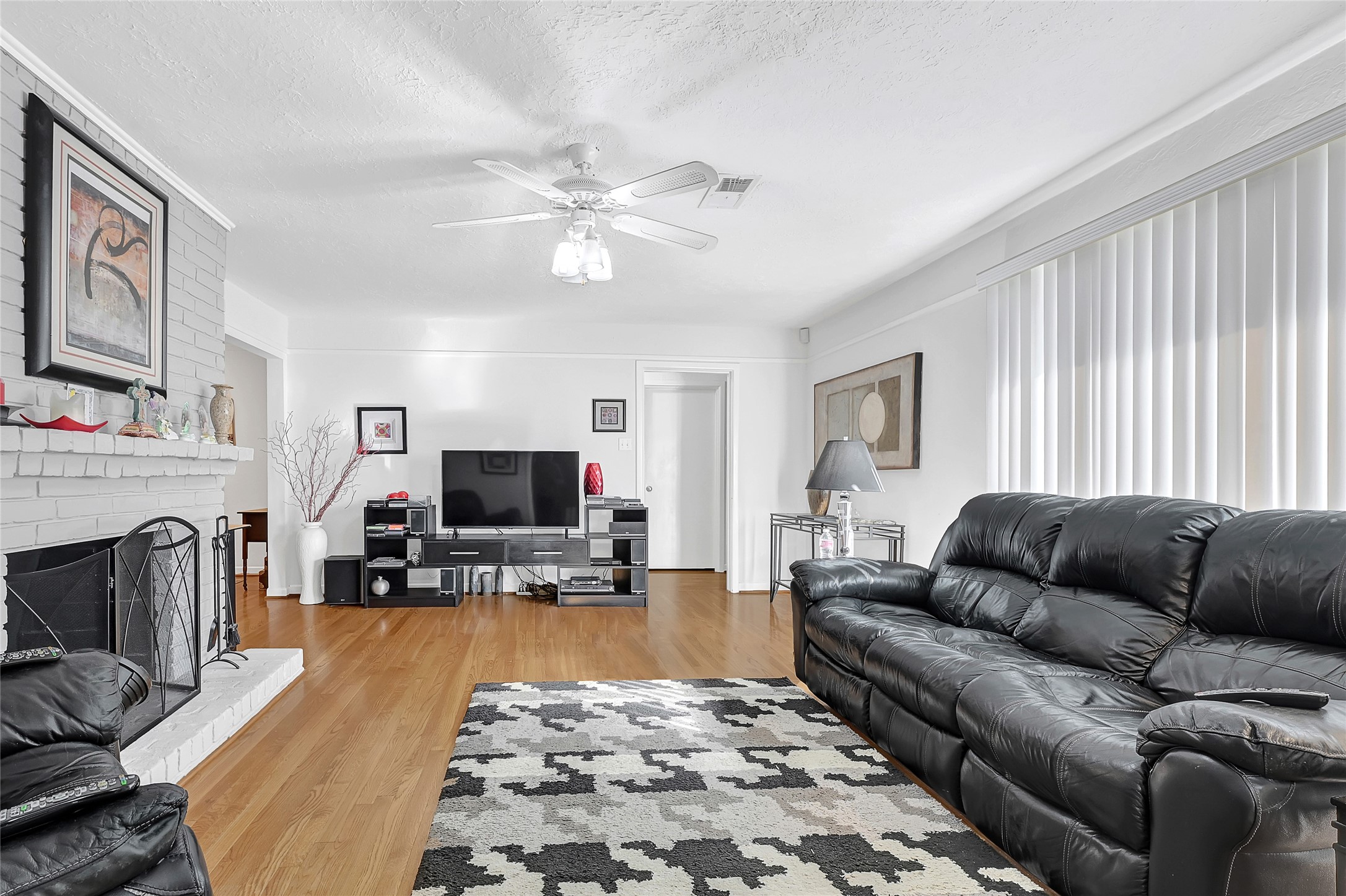 4831 Knickerbocker Street Houston, TX 77035 - Photo 19 of 50 a living room with furniture and a fireplace