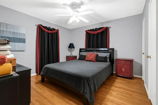 a bedroom with bed and a closet