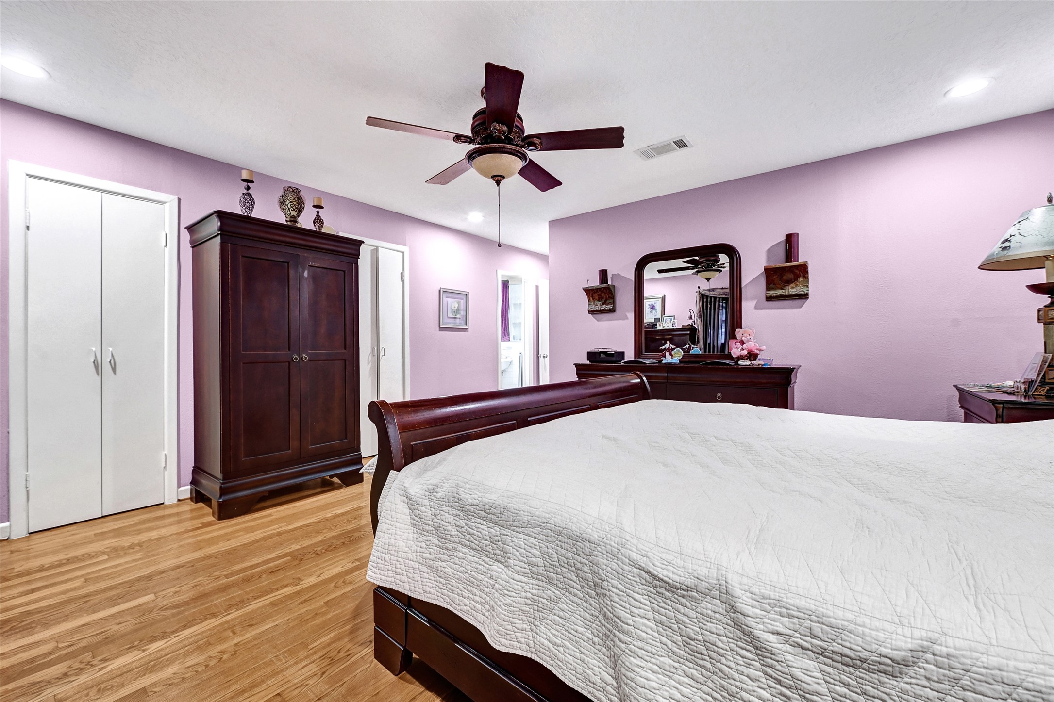 4831 Knickerbocker Street Houston, TX 77035 - Photo 42 of 50 a bedroom with a bed and a chandelier