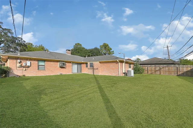 a view of a big house with a big yard