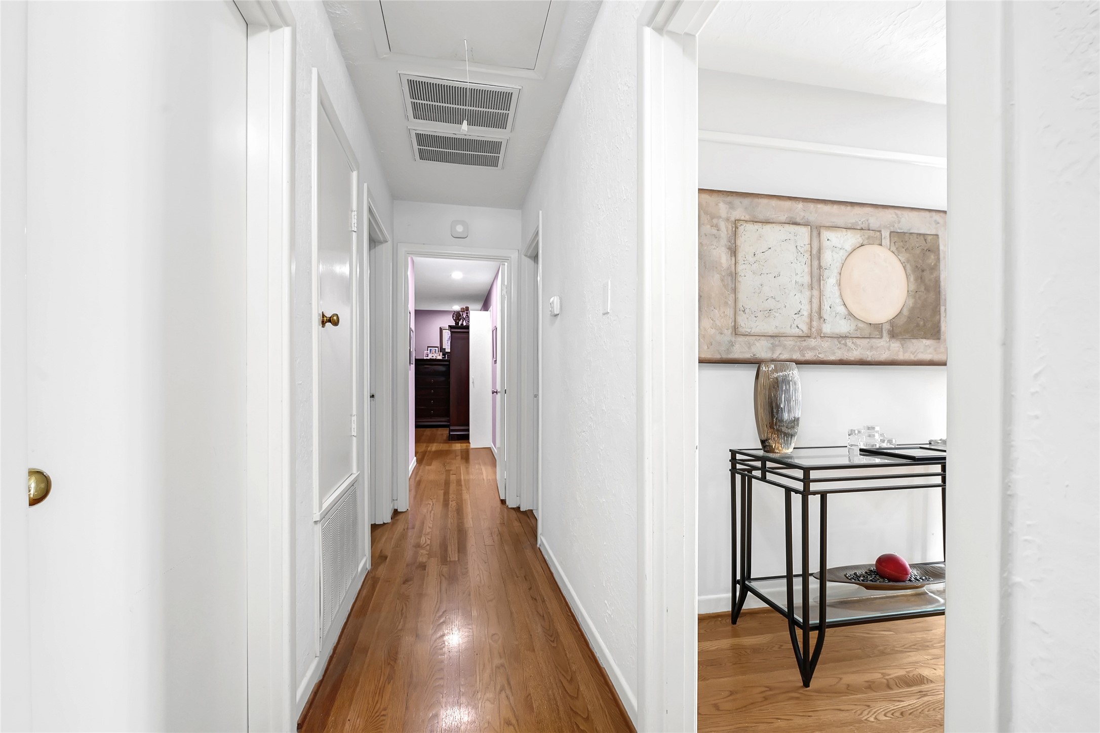 4831 Knickerbocker Street Houston, TX 77035 - Photo 7 of 50 a view of a hallway with wooden floor and entryway