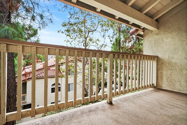 a view of a porch with wooden floor