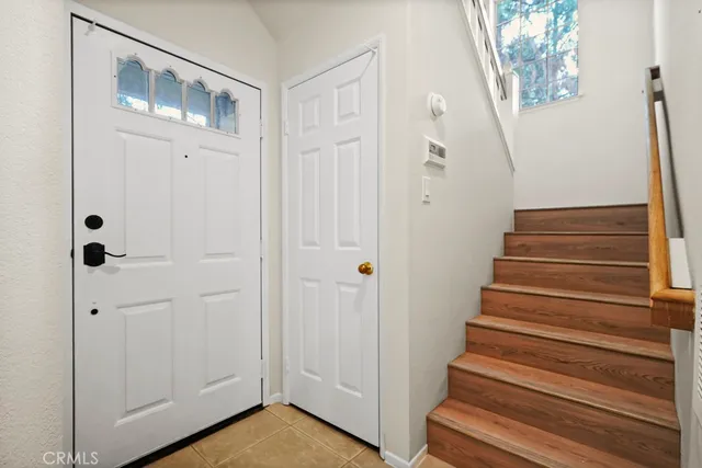a view of an entryway with wooden floor