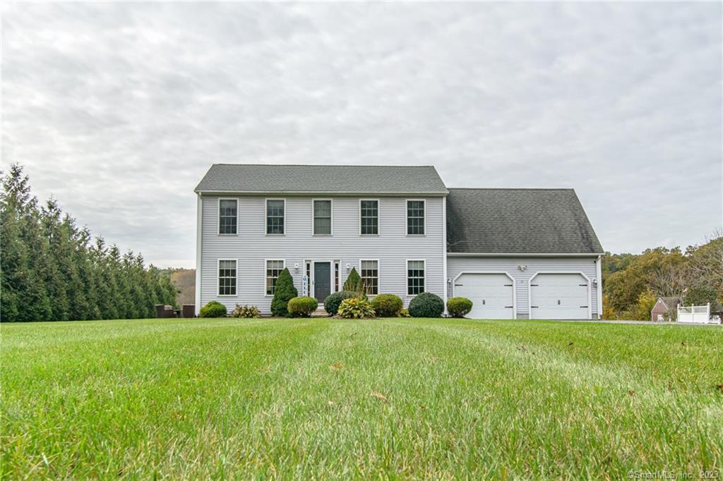 a front view of house with yard