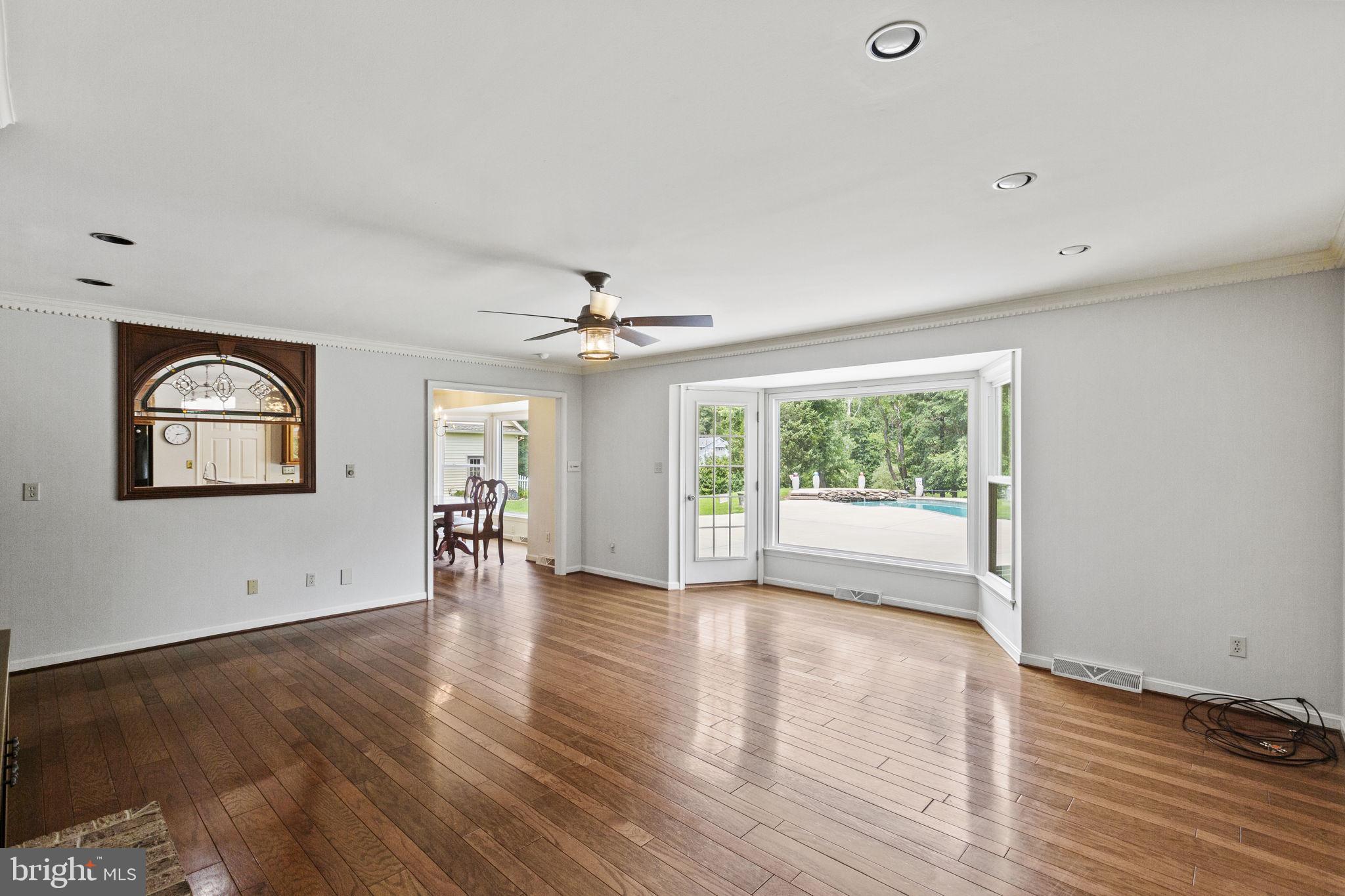 29956 Point Lookout Road Mechanicsville, MD 20659 - Photo 11 of 70 a view of an empty room with a window and wooden floor