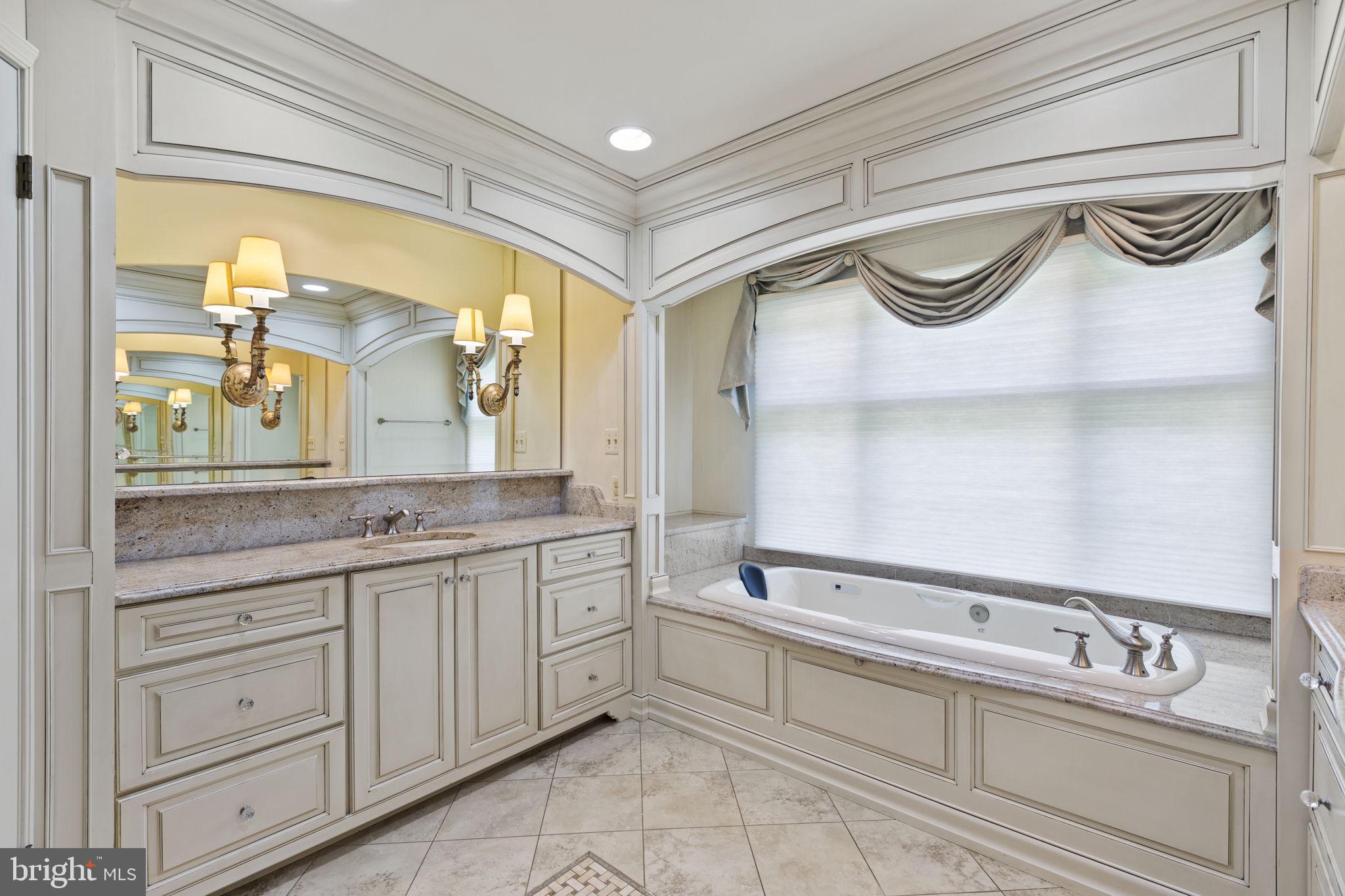 29956 Point Lookout Road Mechanicsville, MD 20659 - Photo 19 of 70 a spacious bathroom with a granite countertop sink mirror and