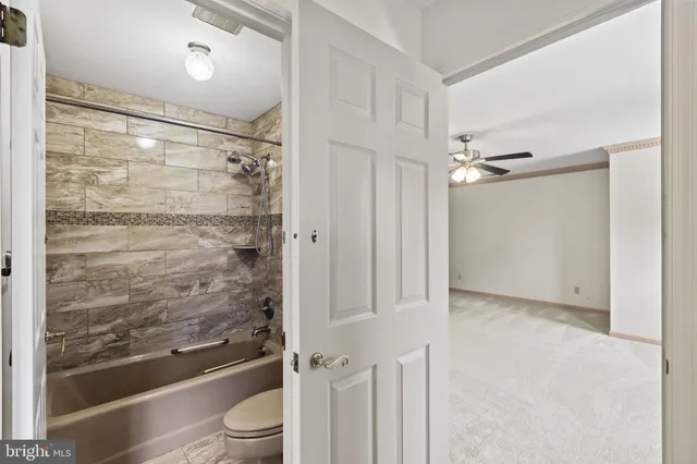 a view of a house with a big yard and large trees