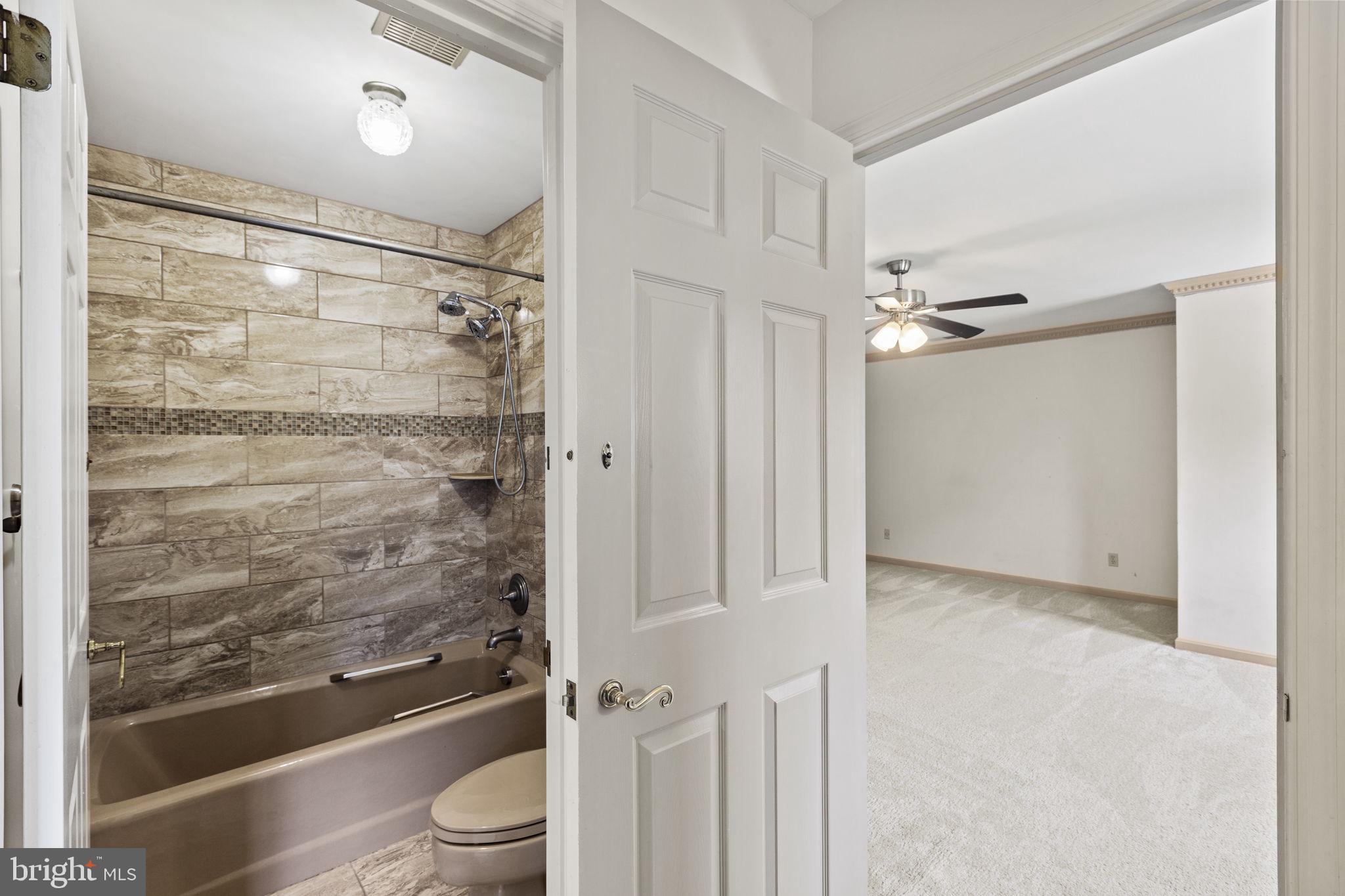 29956 Point Lookout Road Mechanicsville, MD 20659 - Photo 33 of 70 a bathroom with a shower and a toilet