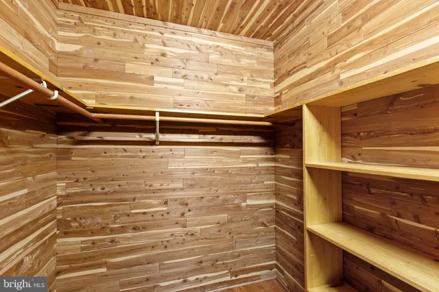 a view of a garden with a building in the background