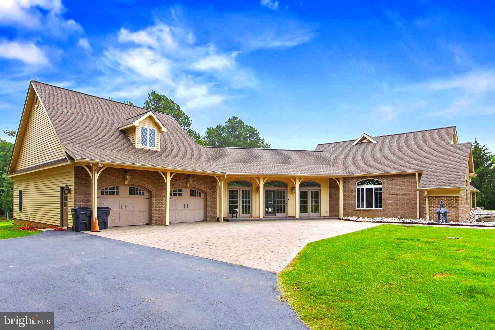 29956 Point Lookout Road Mechanicsville, MD 20659 - Photo 47 of 70 a front view of a house with a garden