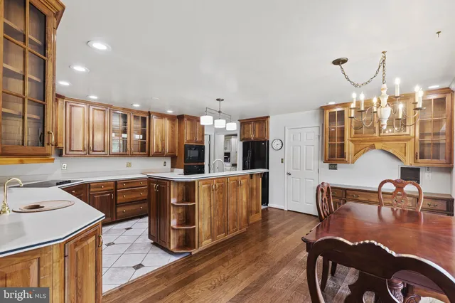 a kitchen with a refrigerator and more cabinets
