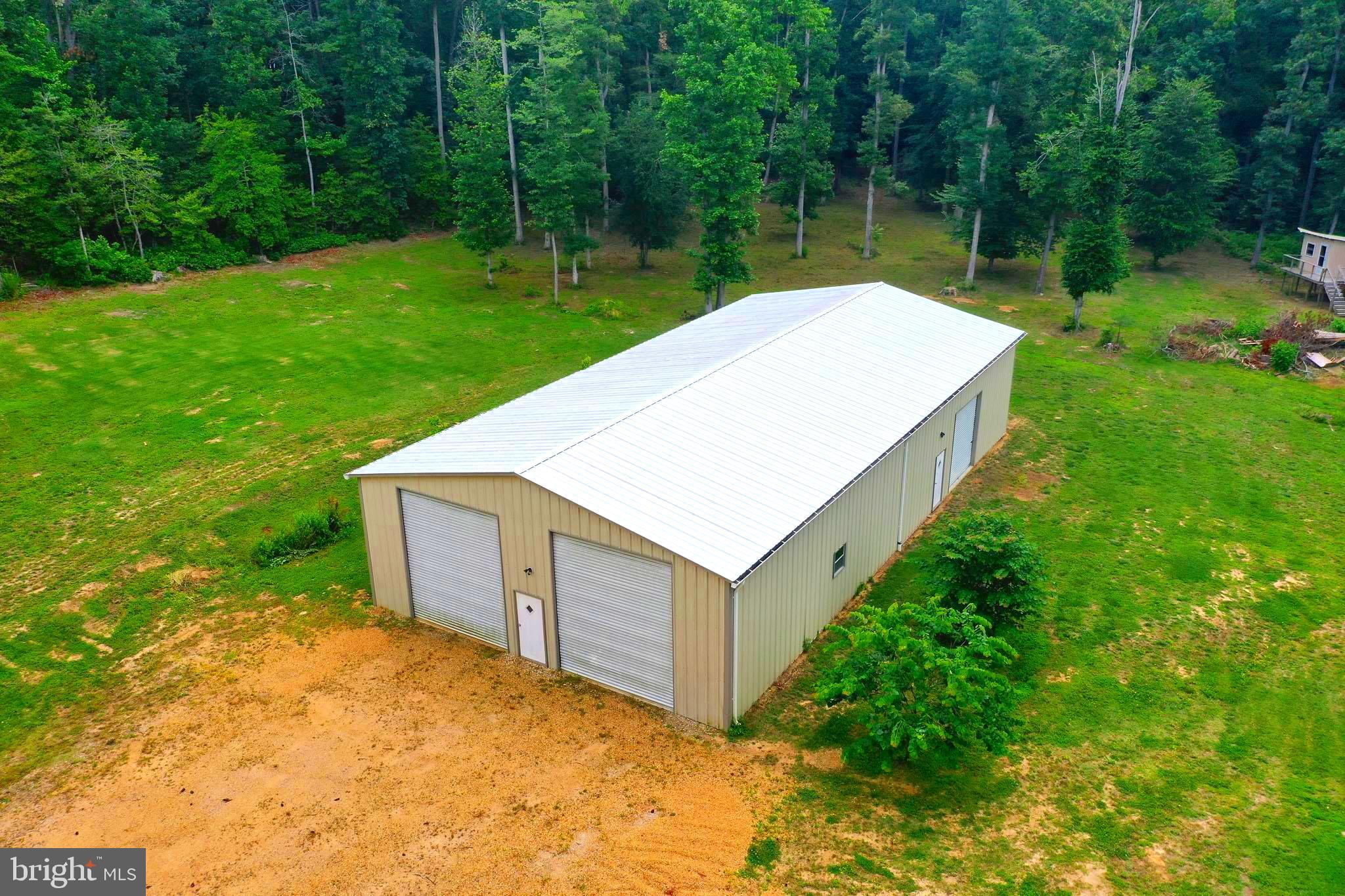 29956 Point Lookout Road Mechanicsville, MD 20659 - Photo 63 of 70 a view of a backyard with a garden and trees