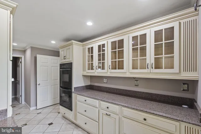 a utility room with refrigerator sink and stove