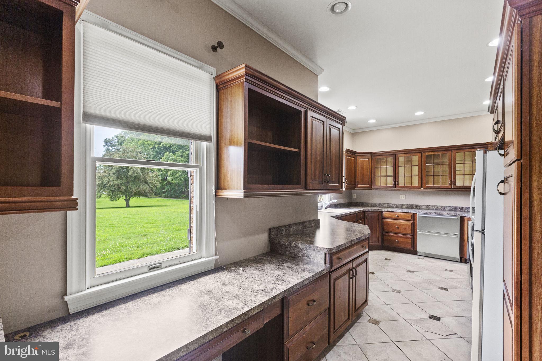 29956 Point Lookout Road Mechanicsville, MD 20659 - Photo 8 of 70 a kitchen with stainless steel appliances granite countertop a sink stove and cabinets