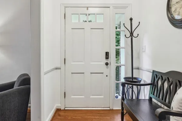 a view of a livingroom with furniture and wooden floor