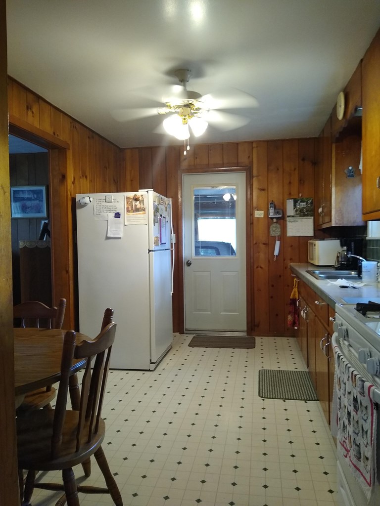 492 Chestnut Street Rimersburg, PA 16248 - Photo 4 of 15 a kitchen with a refrigerator and a stove top oven