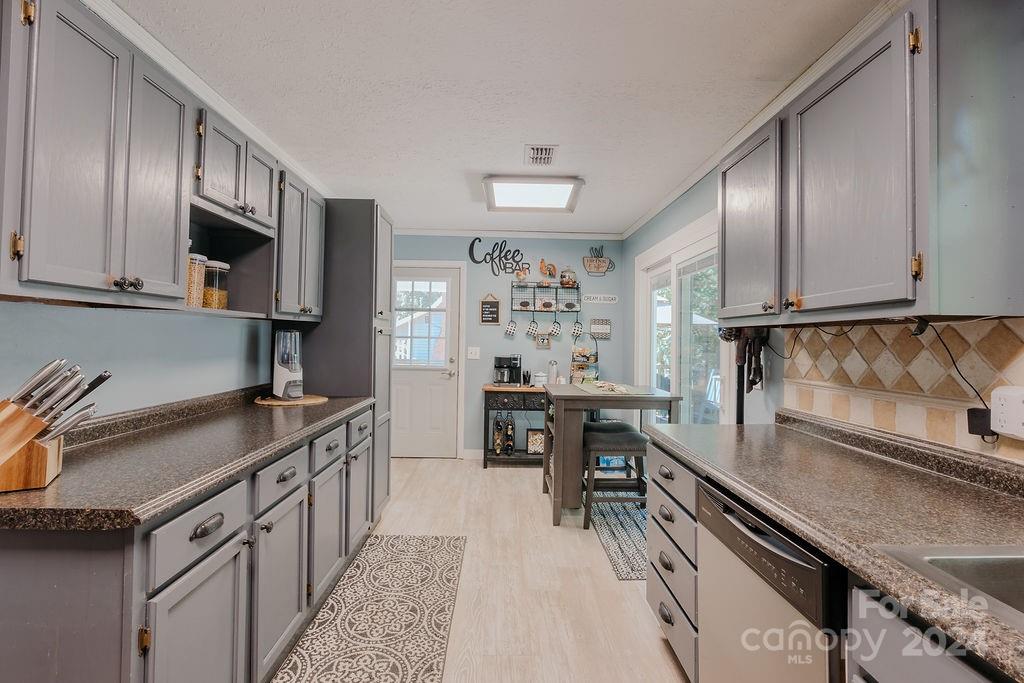 162 Pine Ridge Trail Pinnacle, NC 27043 - Photo 11 of 41 a kitchen with stainless steel appliances granite countertop a sink stove and cabinets