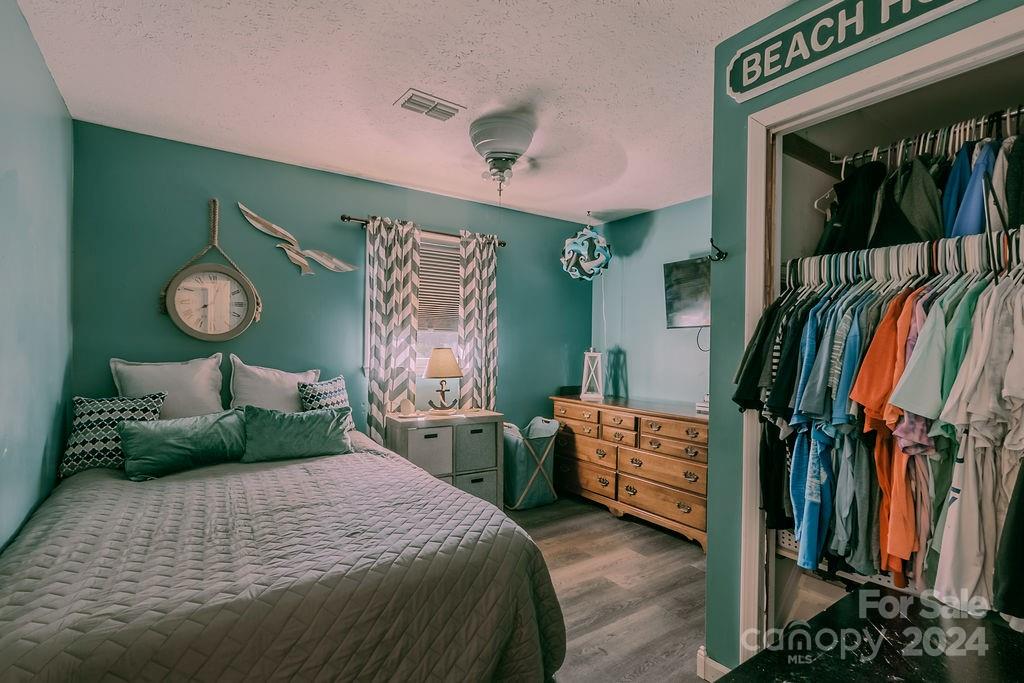 162 Pine Ridge Trail Pinnacle, NC 27043 - Photo 17 of 41 a bedroom with a bed and a mirror