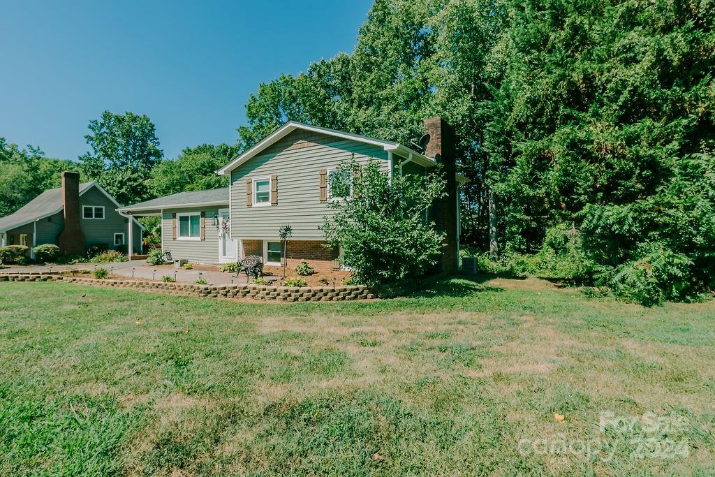 162 Pine Ridge Trail Pinnacle, NC 27043 - Photo 32 of 41 a view of a house with backyard and sitting area
