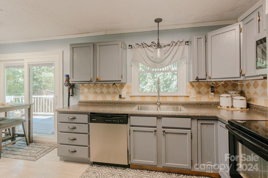 162 Pine Ridge Trail Pinnacle, NC 27043 - Photo 9 of 41 a kitchen with white cabinets and window