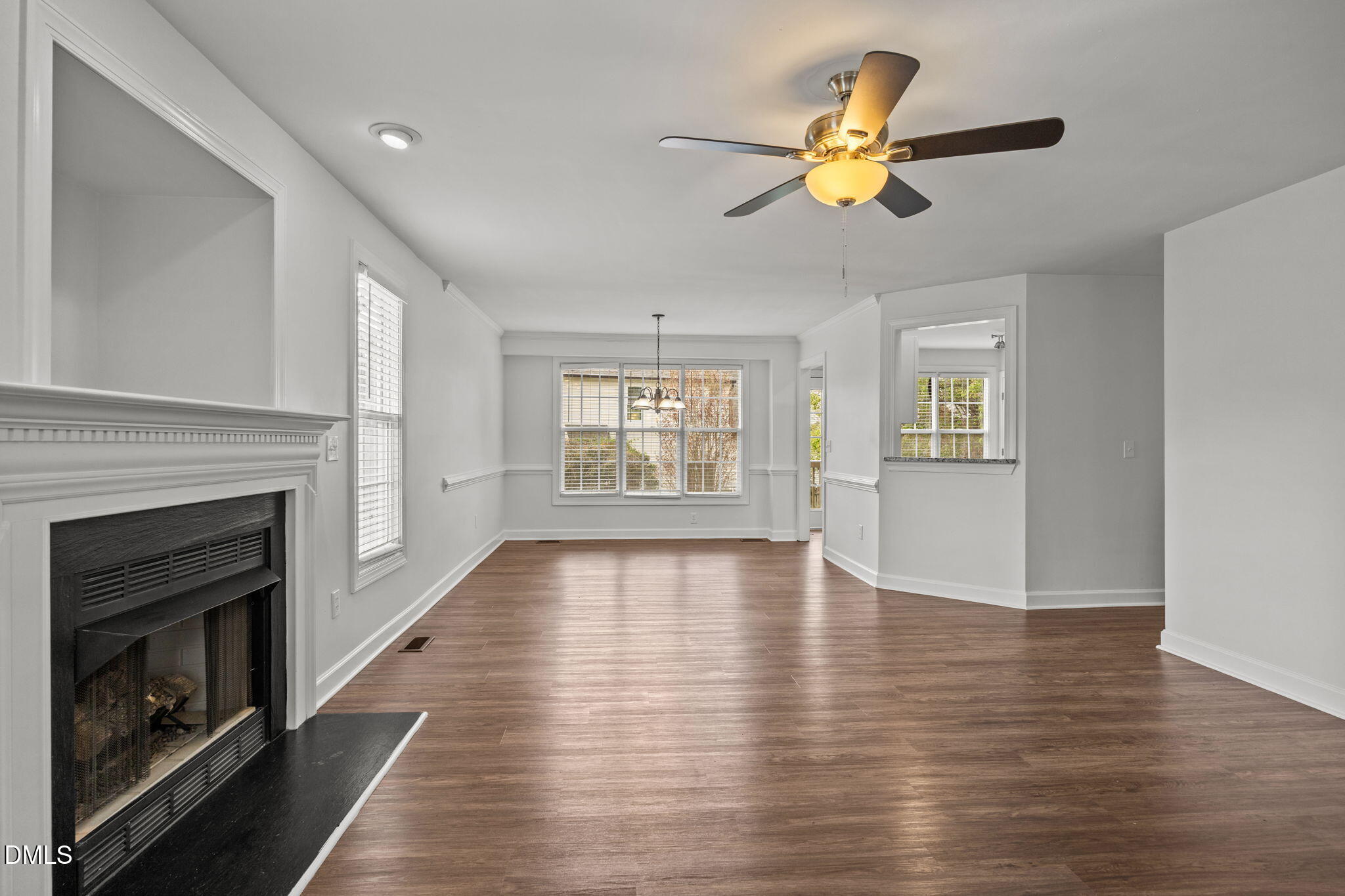 9220 Pennythorne Court Raleigh, NC 27615 - Photo 3 of 49 a view of an empty room with wooden floor and a window