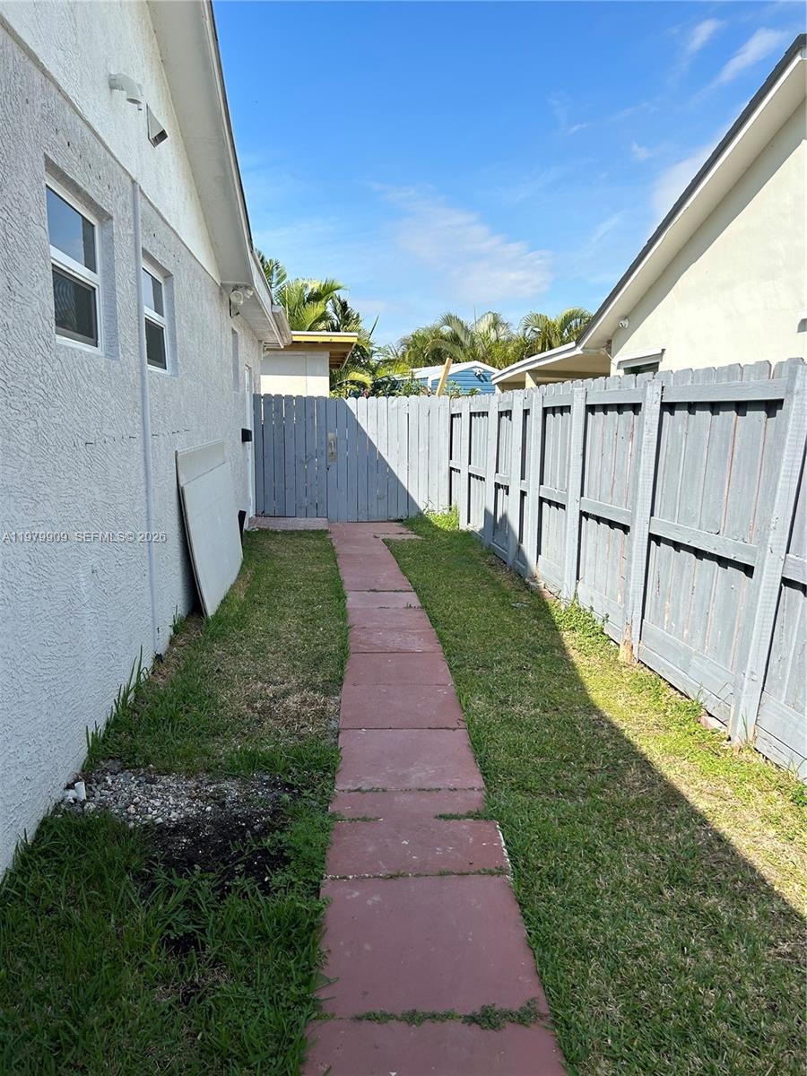13351 Southwest 258th Terrace Homestead, FL 33032 - Photo 2 of 11 a view of a backyard with pathway
