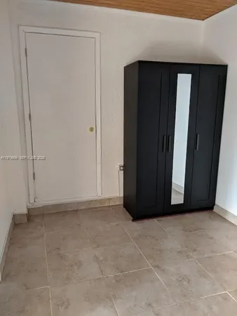 a view of a refrigerator in a bathroom