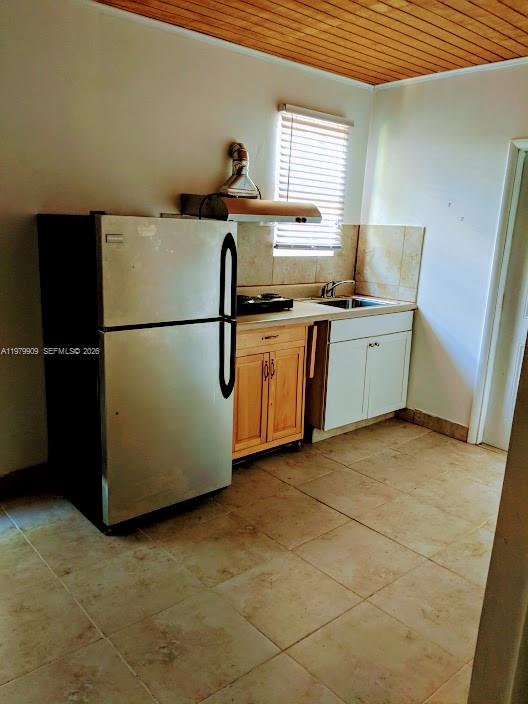 13351 Southwest 258th Terrace Homestead, FL 33032 - Photo 6 of 11 a kitchen with stainless steel appliances granite countertop a refrigerator a sink a stove a microwave a counter space and cabinets