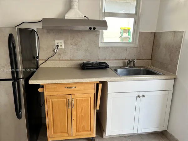 a bathroom with a sink a mirror and a toilet