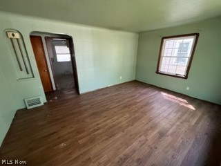 13210 Rockside Road Garfield Heights, OH 44125 - Photo 6 of 15 Empty room featuring dark wood-type flooring