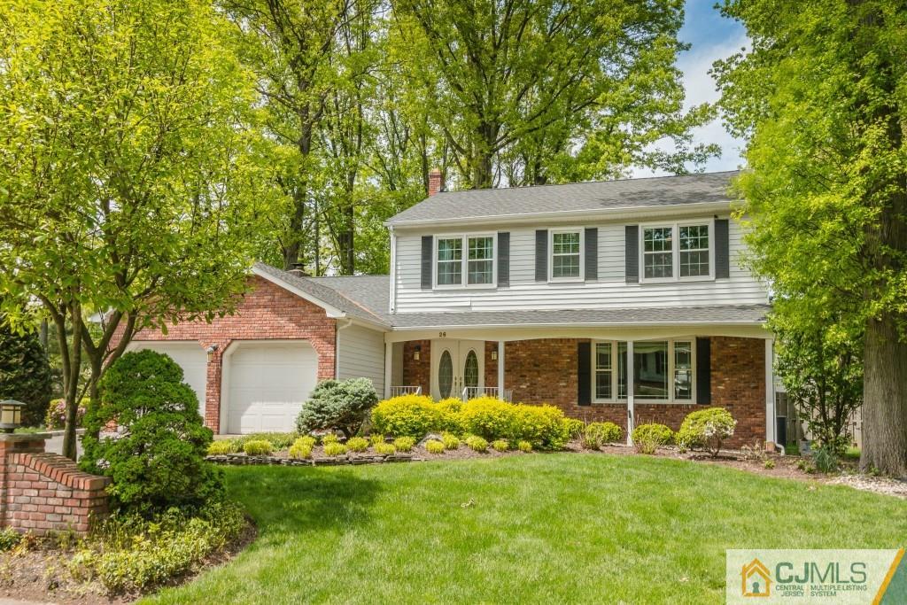 26 Fox Hill Road Edison, NJ 08820 - Photo 1 of 23 a front view of a house with a garden