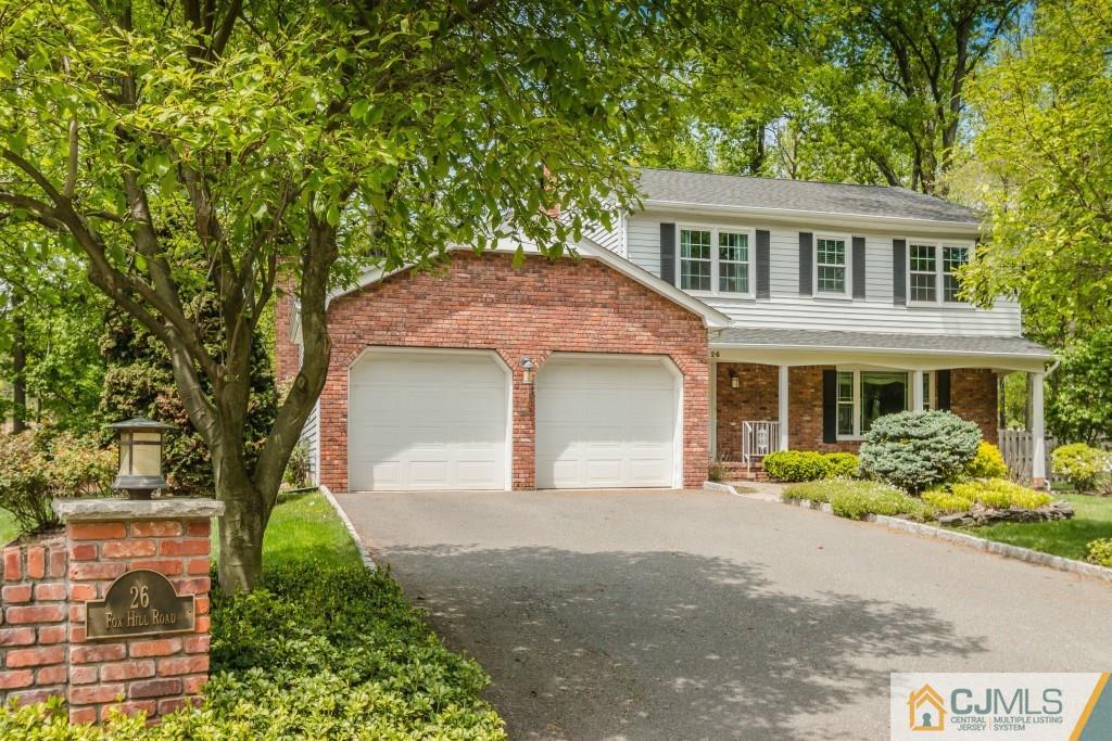 26 Fox Hill Road Edison, NJ 08820 - Photo 2 of 23 a front view of a house with a yard and garage