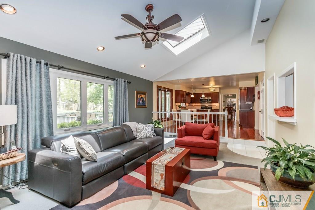 26 Fox Hill Road Edison, NJ 08820 - Photo 11 of 23 a living room with furniture ceiling fan and a large window