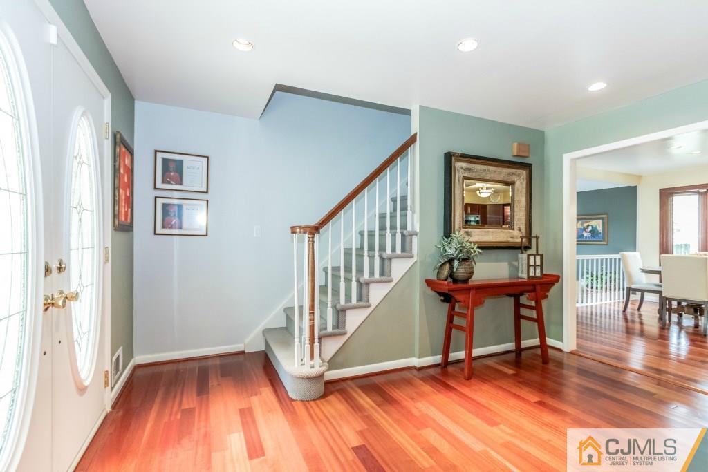 26 Fox Hill Road Edison, NJ 08820 - Photo 14 of 23 a view of front door with dining room and stairs