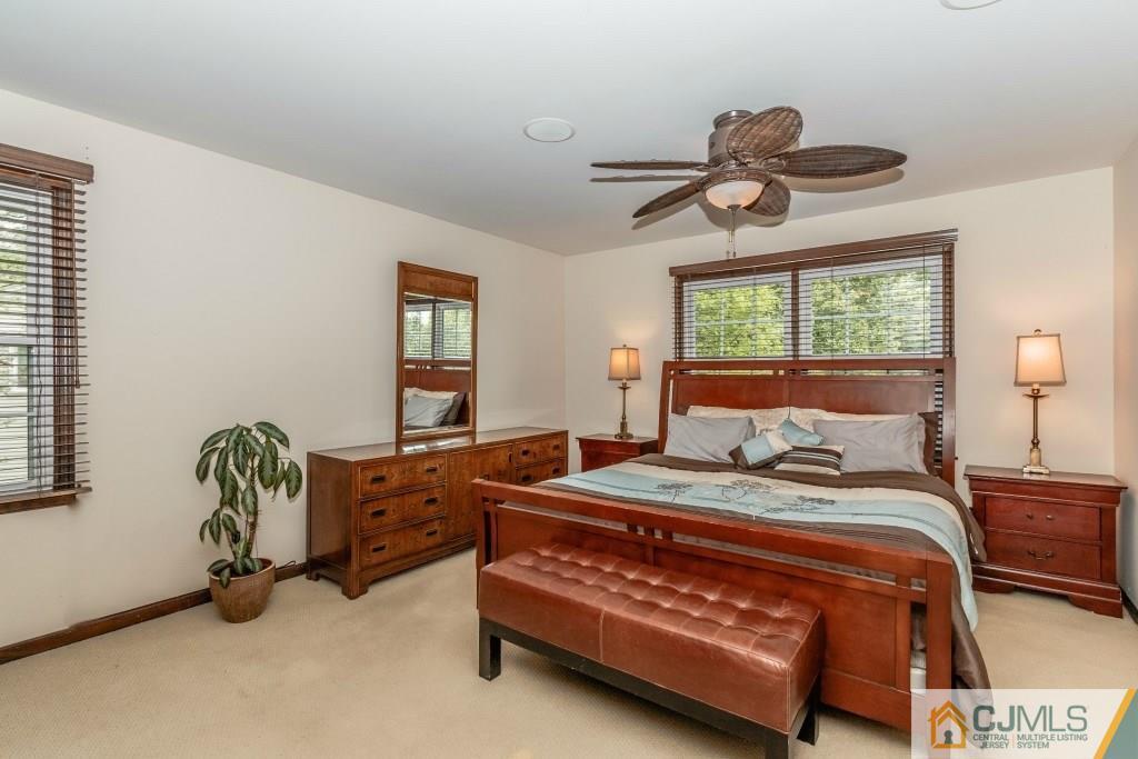 26 Fox Hill Road Edison, NJ 08820 - Photo 15 of 23 a bedroom with a bed mirror and window
